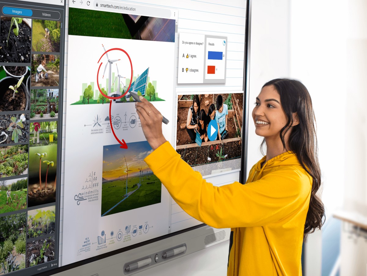 Teacher presenting with a SMART interactive display.